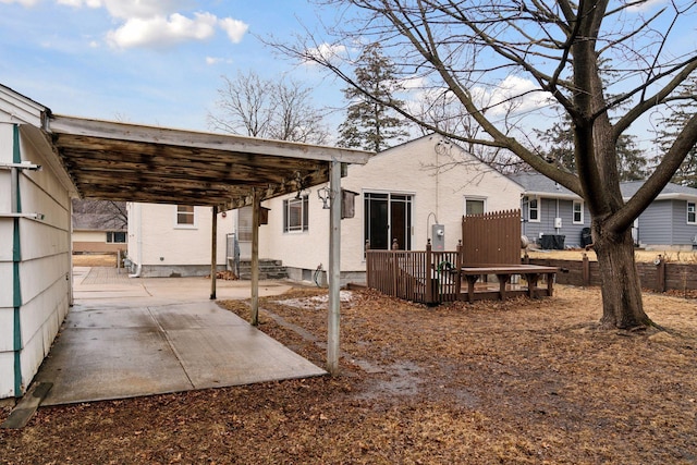 rear view of house with fence