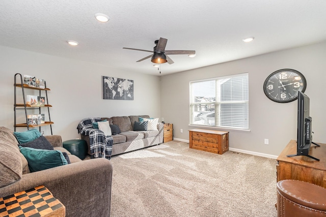 carpeted living room featuring baseboards, recessed lighting, and ceiling fan