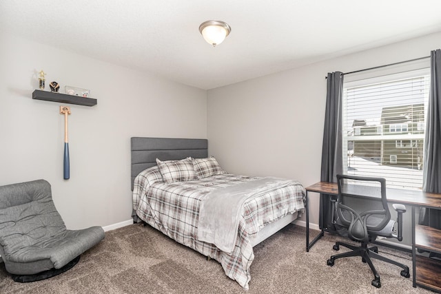 bedroom featuring baseboards and carpet flooring