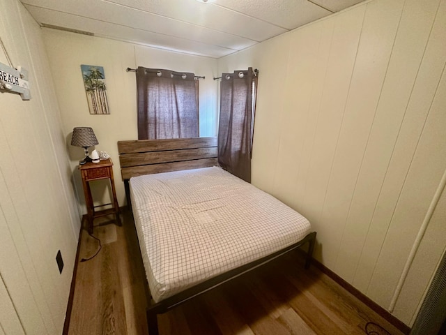 bedroom featuring wood finished floors