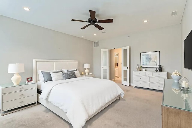 bedroom with ceiling fan, recessed lighting, visible vents, and light colored carpet