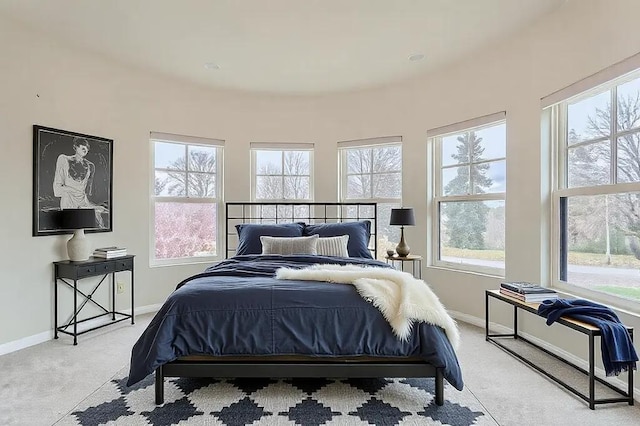 bedroom with carpet floors and baseboards