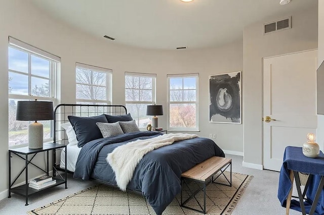 bedroom with visible vents and baseboards