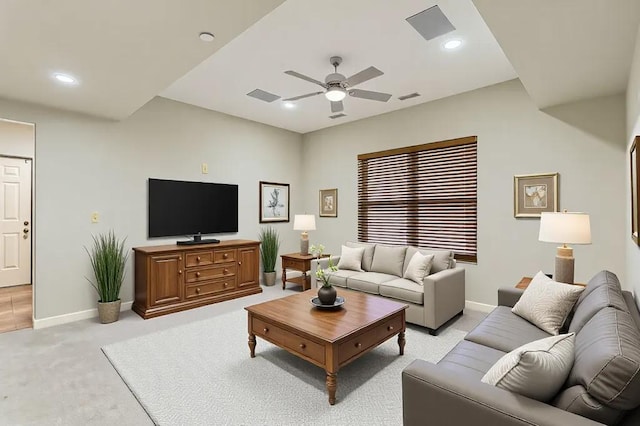 living area with recessed lighting, visible vents, light carpet, and baseboards