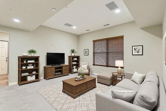 living area featuring light colored carpet, visible vents, and recessed lighting