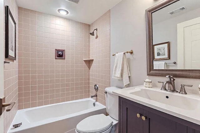 bathroom featuring visible vents, shower / tub combination, vanity, and toilet