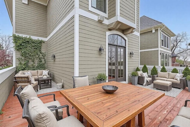 wooden deck featuring an outdoor hangout area, french doors, and outdoor dining space