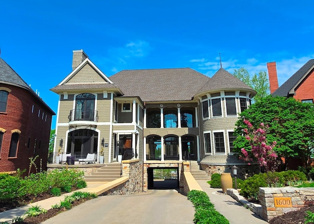 1600 Kenwood Pkwy, Minneapolis, MN 55405 - victorian-style house with a balcony and a shingled roof