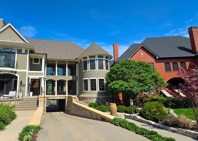 1600 Kenwood Pkwy, Minneapolis, MN 55405 - view of front of house featuring a chimney and a shingled roof