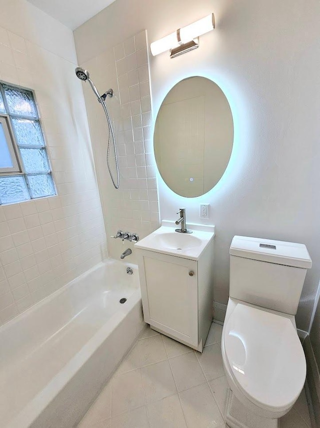 bathroom featuring shower / washtub combination, vanity, toilet, and tile patterned floors