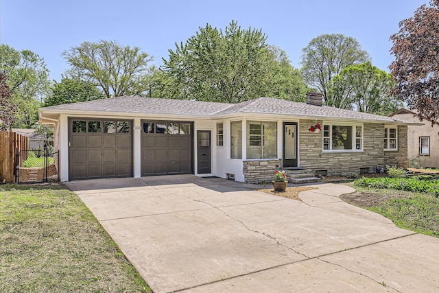 ranch-style home with an attached garage, stone siding, driveway, a chimney, and fence