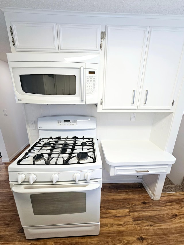 room details featuring white appliances and white cabinetry