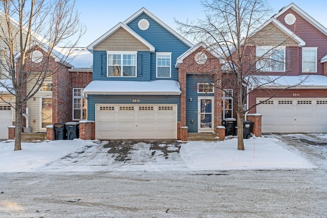 view of front of home with brick siding and an attached garage