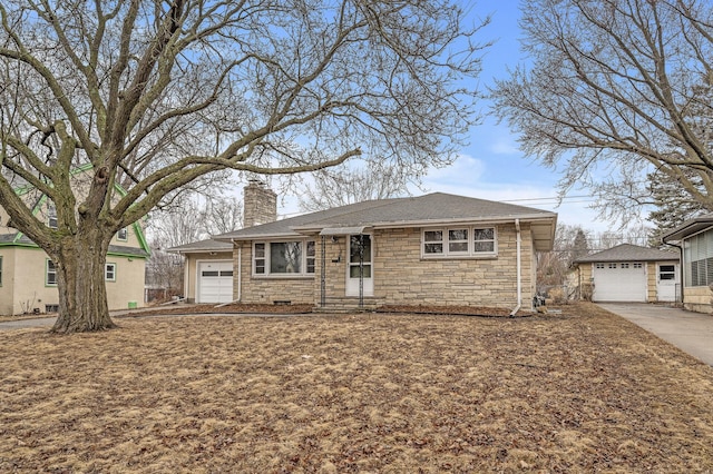 view of front of home with a garage, a chimney, and an outdoor structure