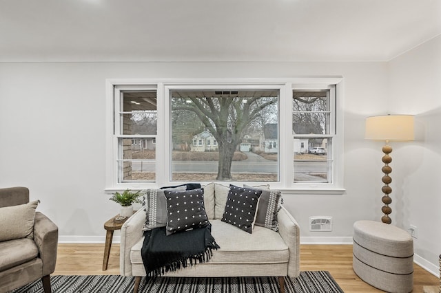 interior space with wood finished floors and baseboards