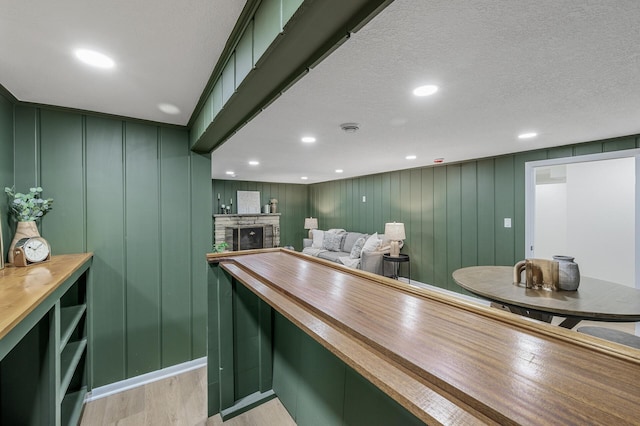 kitchen featuring wood counters and green cabinetry