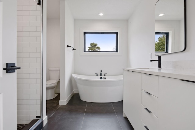 bathroom featuring toilet, a soaking tub, tile patterned flooring, vanity, and a shower stall