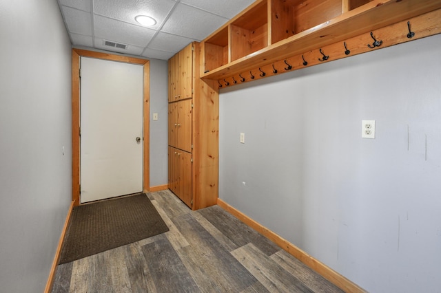mudroom featuring baseboards, wood finished floors, and visible vents