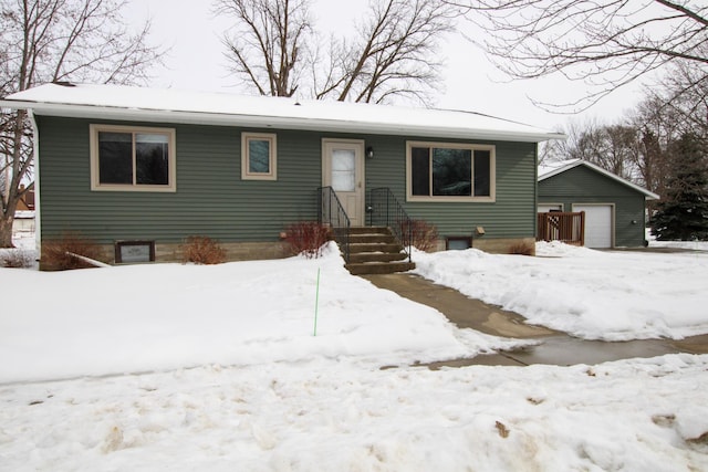 view of front of house with an outbuilding and a detached garage