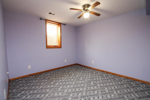 unfurnished room featuring a ceiling fan, carpet, visible vents, and baseboards