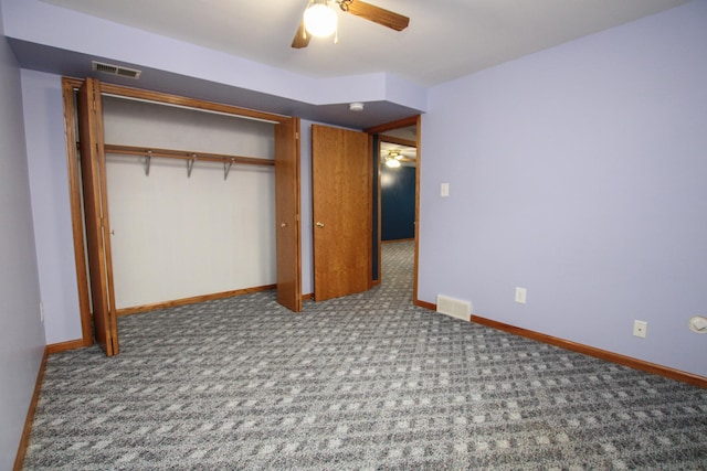 unfurnished bedroom featuring baseboards, carpet, visible vents, and a closet