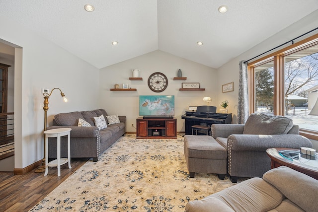 living area featuring lofted ceiling, a textured ceiling, recessed lighting, wood finished floors, and baseboards