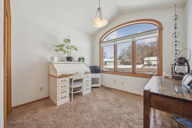 office area featuring visible vents, light carpet, vaulted ceiling, a textured ceiling, and baseboards