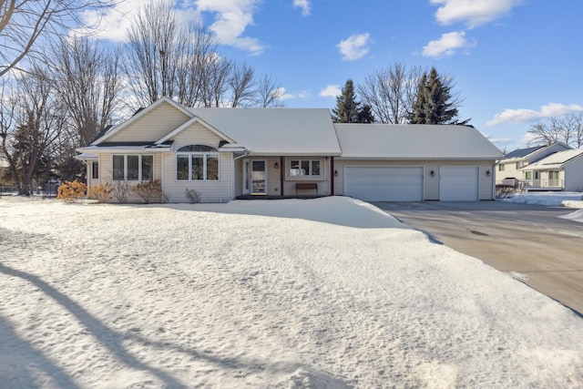 ranch-style home with driveway and an attached garage