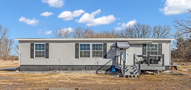 manufactured / mobile home featuring a deck