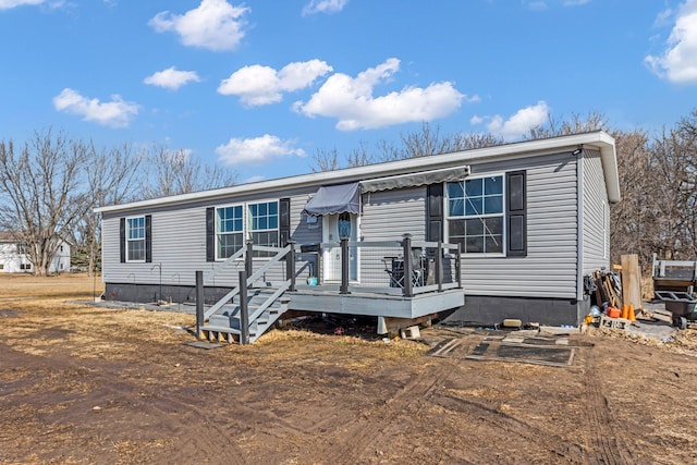 view of front of property featuring a wooden deck