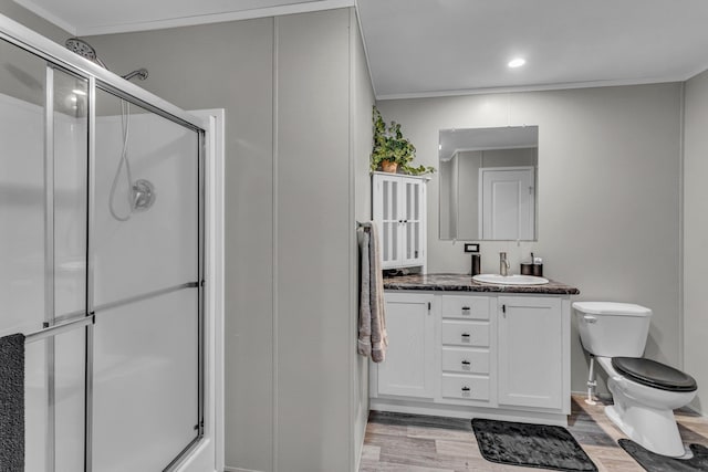 27939 Forest Blvd, Wyoming, MN 55092 - full bath featuring wood finished floors, double vanity, a shower with door, recessed lighting, and ornamental molding