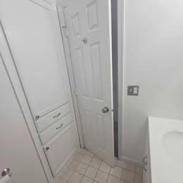 bathroom featuring tile patterned flooring and vanity