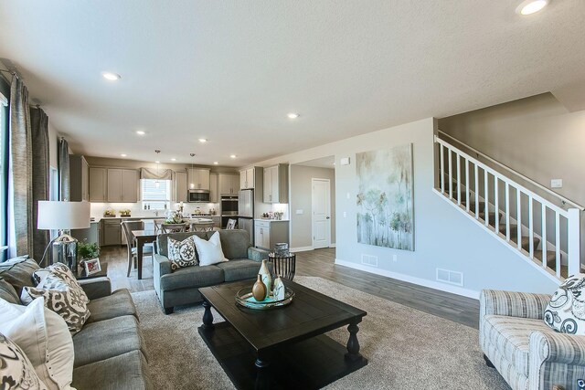 4601 Percheron Blvd, Chaska, MN 55318 - living area with visible vents, recessed lighting, wood finished floors, and stairs