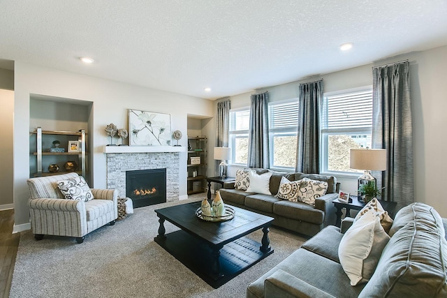 4601 Percheron Blvd, Chaska, MN 55318 - living room featuring a textured ceiling, recessed lighting, and a fireplace