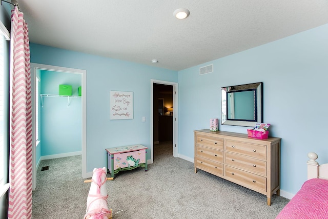 4601 Percheron Blvd, Chaska, MN 55318 - bedroom featuring a spacious closet, light carpet, and visible vents