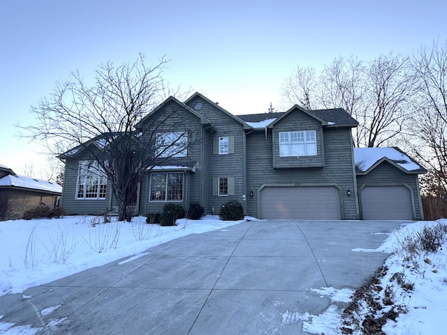 view of front of house featuring a garage and concrete driveway