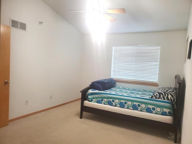 bedroom featuring carpet, visible vents, vaulted ceiling, ceiling fan, and baseboards