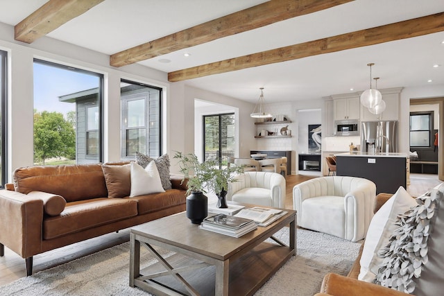 living room featuring recessed lighting and beamed ceiling