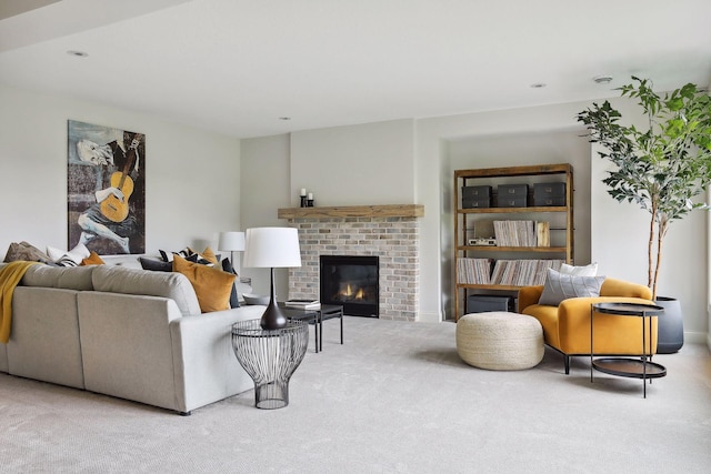 living room with carpet floors, recessed lighting, and a brick fireplace