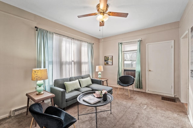 living room featuring ceiling fan, baseboard heating, carpet, and visible vents