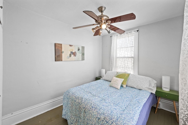 bedroom featuring dark wood-style flooring and ceiling fan