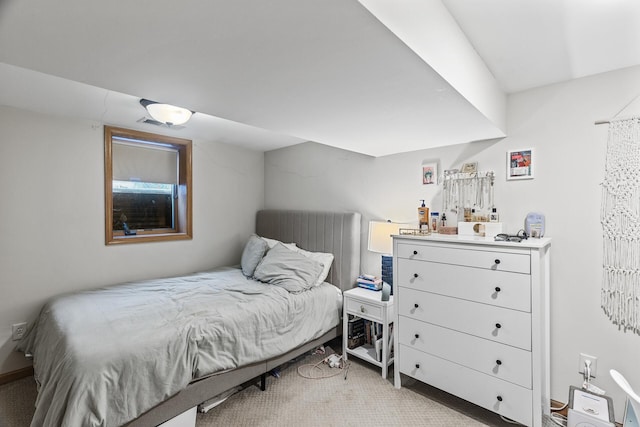 bedroom with visible vents and light colored carpet