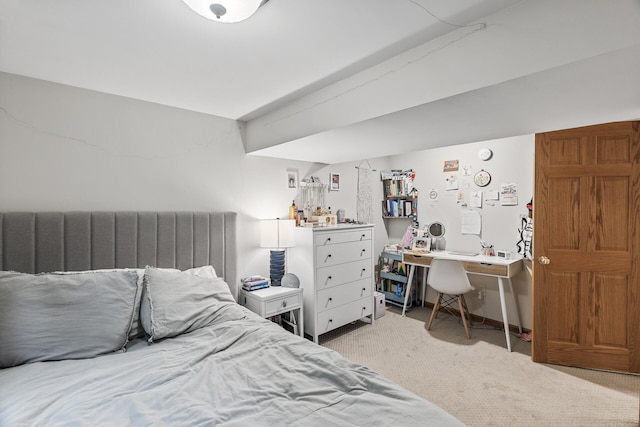 bedroom featuring light carpet