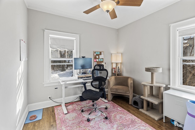 office area with a ceiling fan, baseboards, and dark wood-style flooring