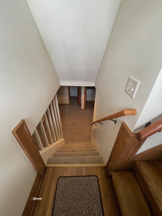 stairs with wood finished floors