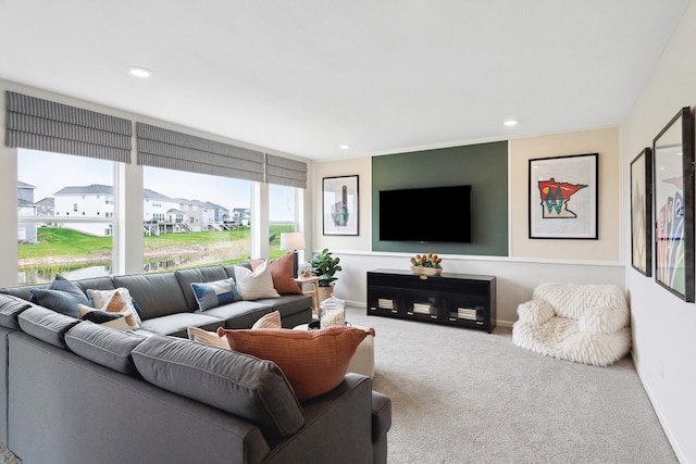 living area with baseboards, carpet floors, a residential view, and recessed lighting