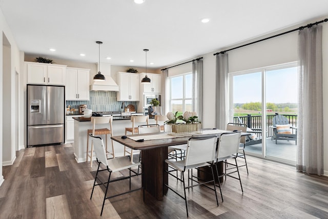 dining area featuring dark wood finished floors and recessed lighting