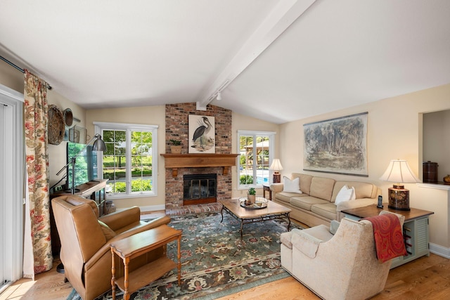 2135 Shadyview Ln N, Plymouth, MN 55447 - living area with wood finished floors, a brick fireplace, and baseboards