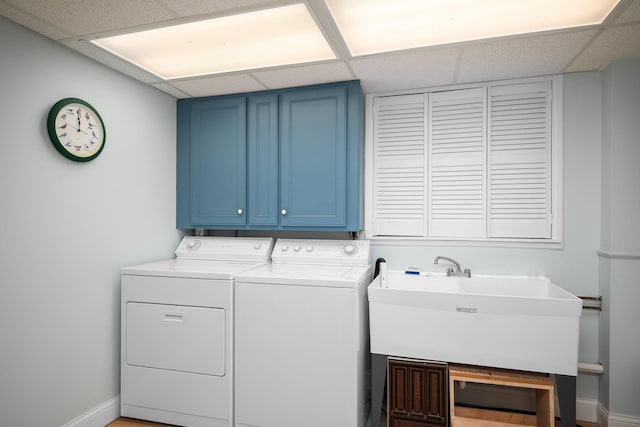 2135 Shadyview Ln N, Plymouth, MN 55447 - laundry room with washer and clothes dryer, cabinet space, and baseboards