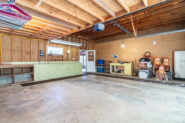 garage featuring a workshop area and a garage door opener